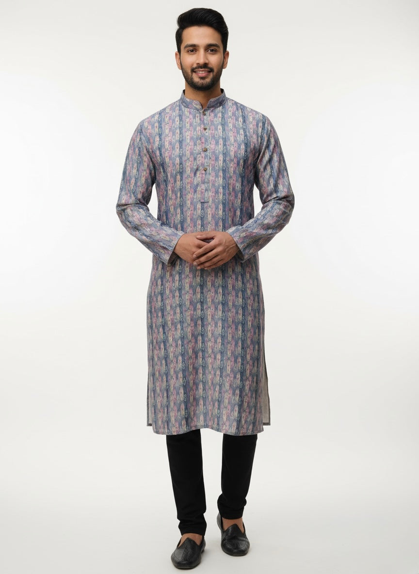 Man wearing a patterned kurta with black pants on a white background