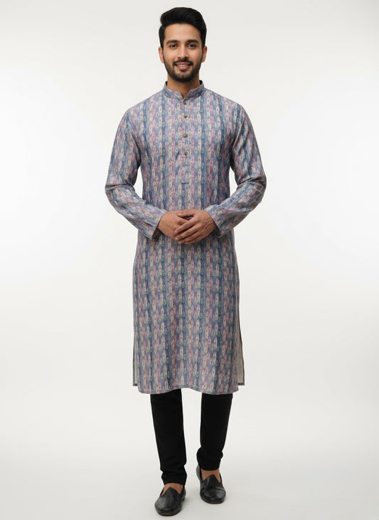 Man wearing a patterned kurta with black pants on a white background